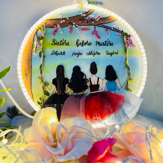 Decorative plate with silhouettes of four women and the text 'Sisters before misters' on a white background.